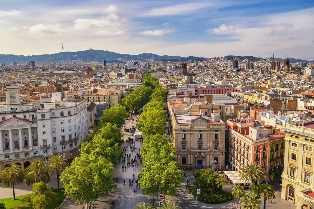Take a walk along La Rambla – the famous boulevard of Barcelona.